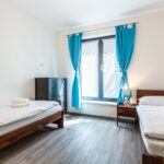 Pokoj se dvěma jednolůžky apartmánu Adina 2
